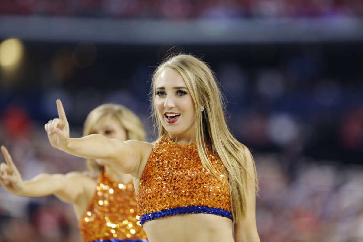 Florida cheerleaders perform during the first half of the NCAA Final Four tournament college basketball semifinal game against Connecticut Saturday, April 5, 2014, in Arlington, Texas. (AP Photo/David J. Phillip)