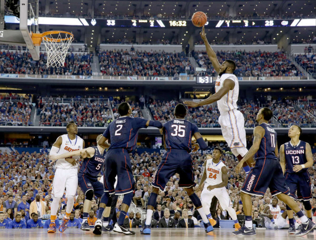 Florida center Patric Young shoots against Connecticut during the second half of the NCAA Final Four tournament college basketball semifinal game Saturday, April 5, 2014, in Arlington, Texas. (AP Photo/David J. Phillip)
