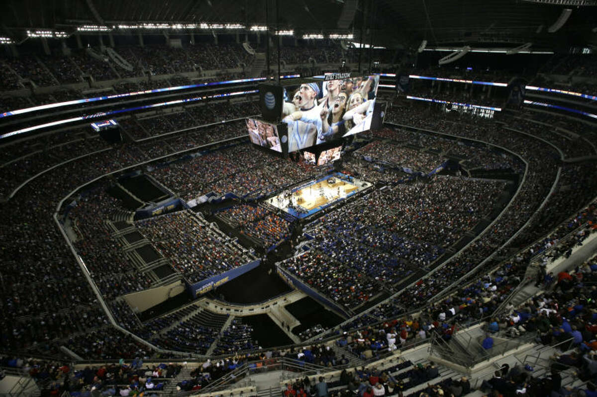 Fans look on during the first half of an NCAA Final Four tournament college basketball semifinal game between Connecticut and Florida Saturday, April 5, 2014, in Arlington, Texas. (AP Photo/David J. Phillip)