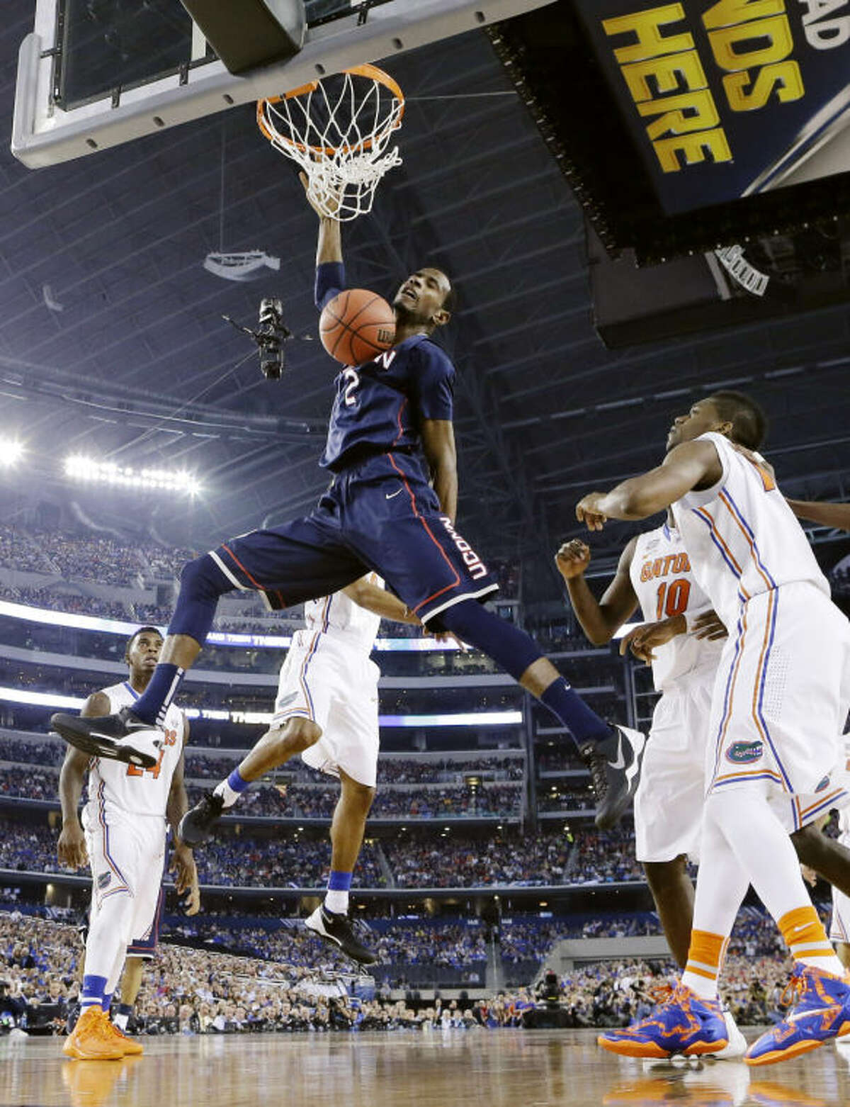 Connecticut forward DeAndre Daniels (2) dunks the ball against Florida during the second half of the NCAA Final Four tournament college basketball semifinal game Saturday, April 5, 2014, in Arlington, Texas. (AP Photo/Eric Gay)
