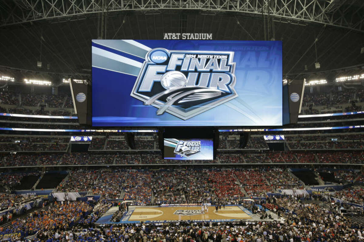 Fans look on during the first half of an NCAA Final Four tournament college basketball semifinal game between Connecticut and Florida Saturday, April 5, 2014, in Arlington, Texas. (AP Photo/Tony Gutierrez)