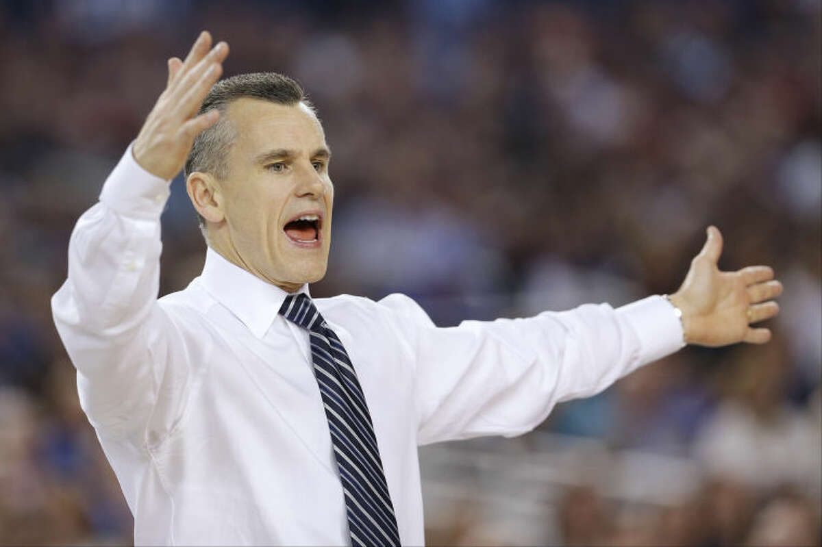 Florida head coach Billy Donovan works the sideline against Connecticut during the second half of the NCAA Final Four tournament college basketball semifinal game Saturday, April 5, 2014, in Arlington, Texas. (AP Photo/David J. Phillip)
