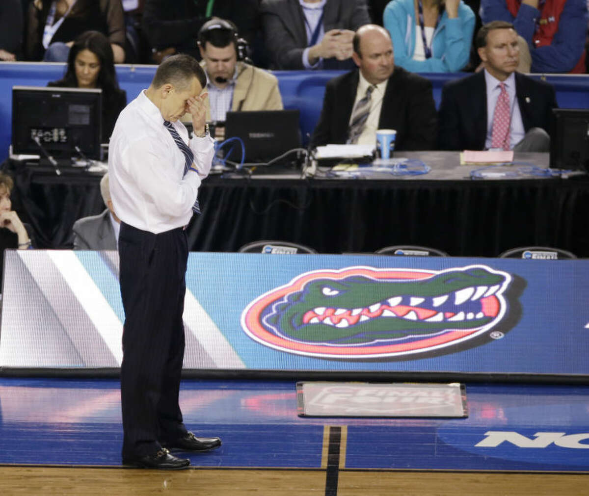 Florida head coach Billy Donovan reacts during the second half of an NCAA Final Four tournament college basketball semifinal game against Connecticut Saturday, April 5, 2014, in Arlington, Texas. Connecticut won 63-53. (AP Photo/Tony Gutierrez)