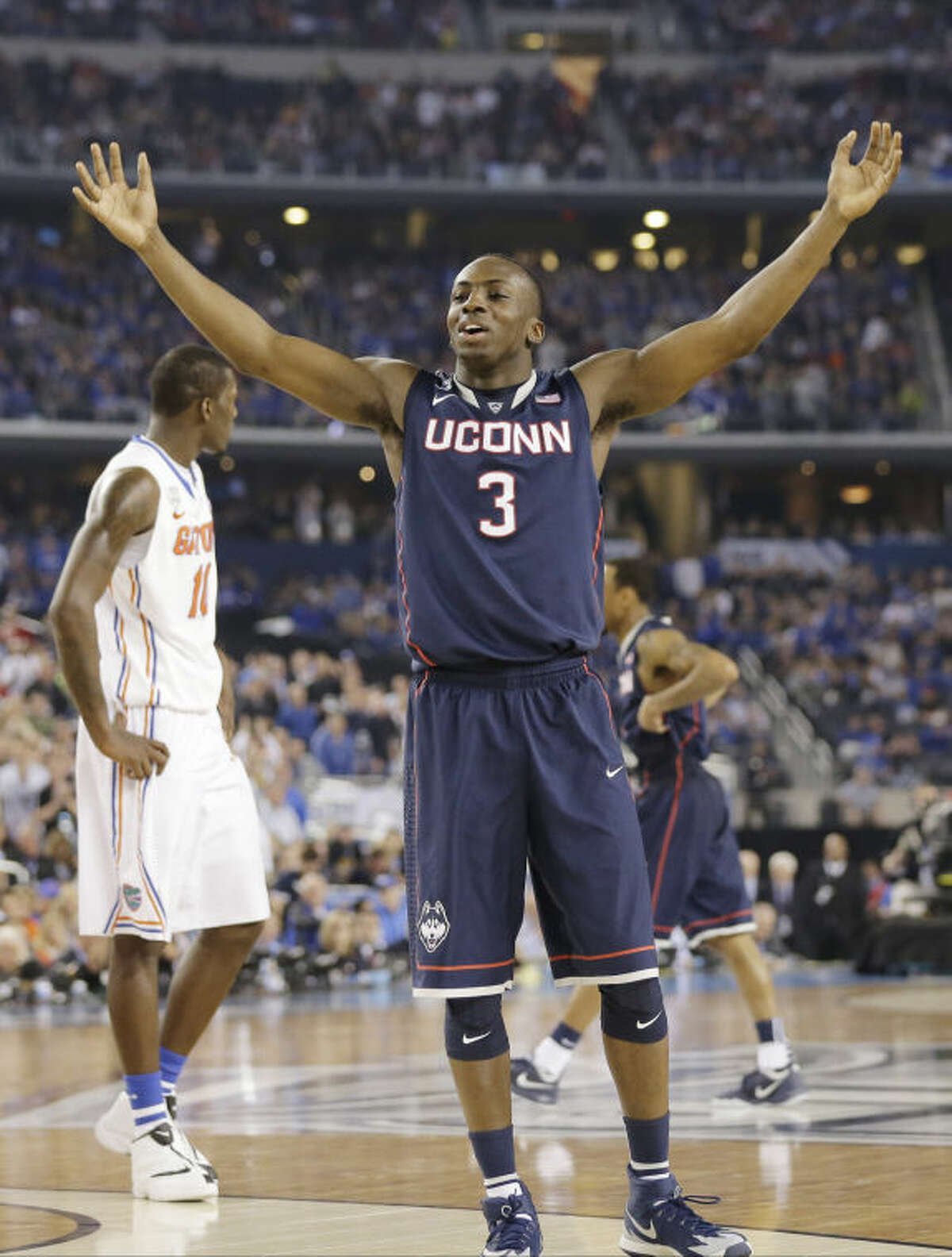 Connecticut guard Terrence Samuel celebrates against Florida during the second half of the NCAA Final Four tournament college basketball semifinal game Saturday, April 5, 2014, in Arlington, Texas. (AP Photo/Eric Gay)