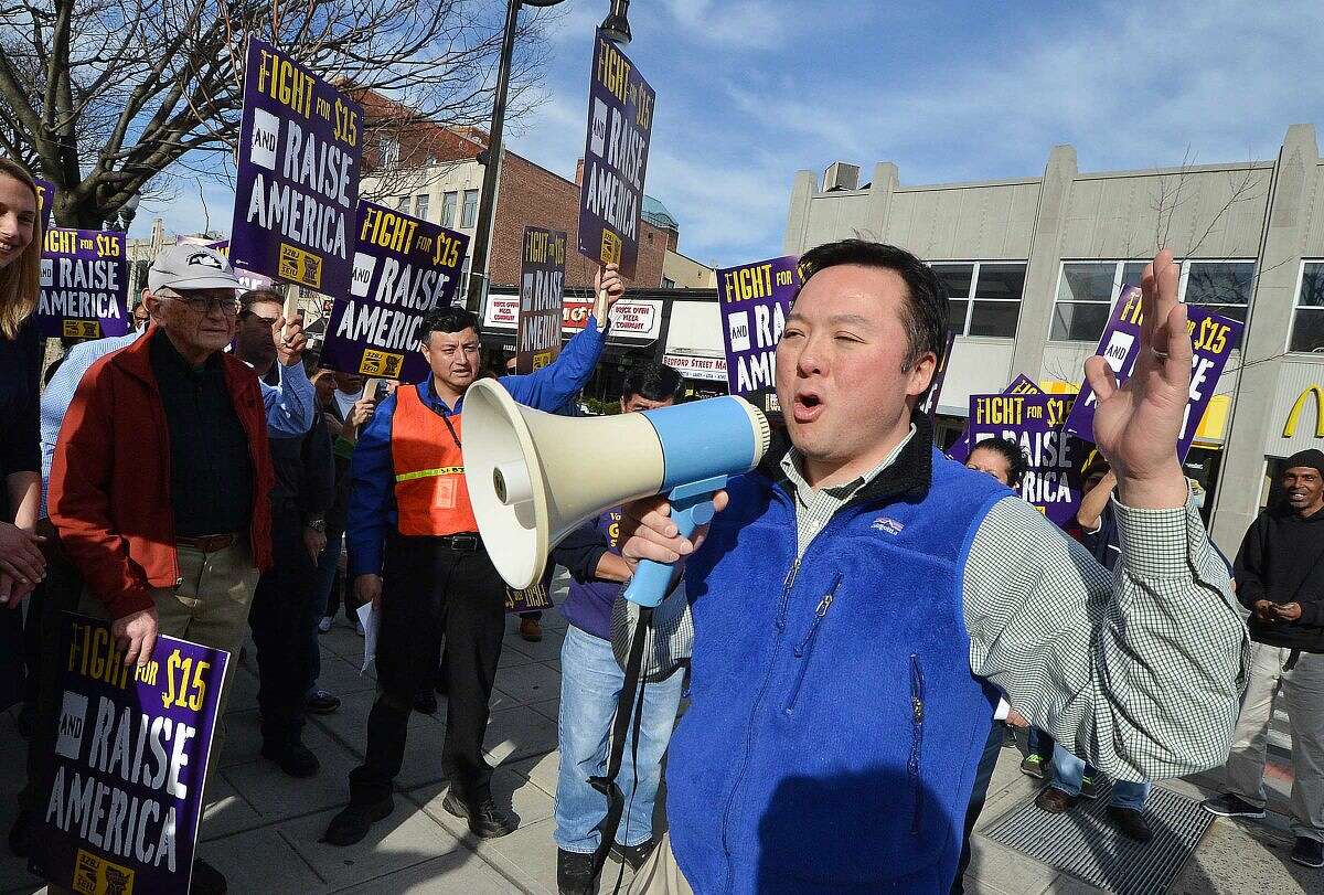 Hour Photo/Alex von Kleydorff State Rep. William tong 147th dist. joins janitors in downtown Stamford to rally for higher wages and to echo the global wave of protests against wage inequality that has been called the 'Fight for $15'. Members of 32BJ Union in Stamford march as workers across the country mobilize against income inequality.