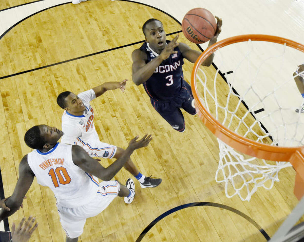 Connecticut guard Terrence Samuel (3) shoots against Florida during the second half of the NCAA Final Four tournament college basketball semifinal game Saturday, April 5, 2014, in Arlington, Texas. (AP Photo/Chris Steppig, pool)
