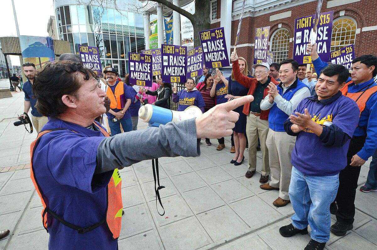 Hour Photo/Alex von Kleydorff Workers unite in downtown Stamford to rally for higher wages and to echo the global wave of protests against wage inequality that has been called the 'Fight for $15'. Members of 32BJ Union in Stamford march as workers across the country mobilize against income inequality.