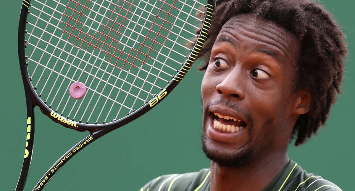 Gael Monfils of France reacts during his match of the Monte Carlo Tennis Masters tournament against Roger Federer of Switzerland, in Monaco, Thursday, April 16, 2015. (AP Photo/Lionel Cironneau)