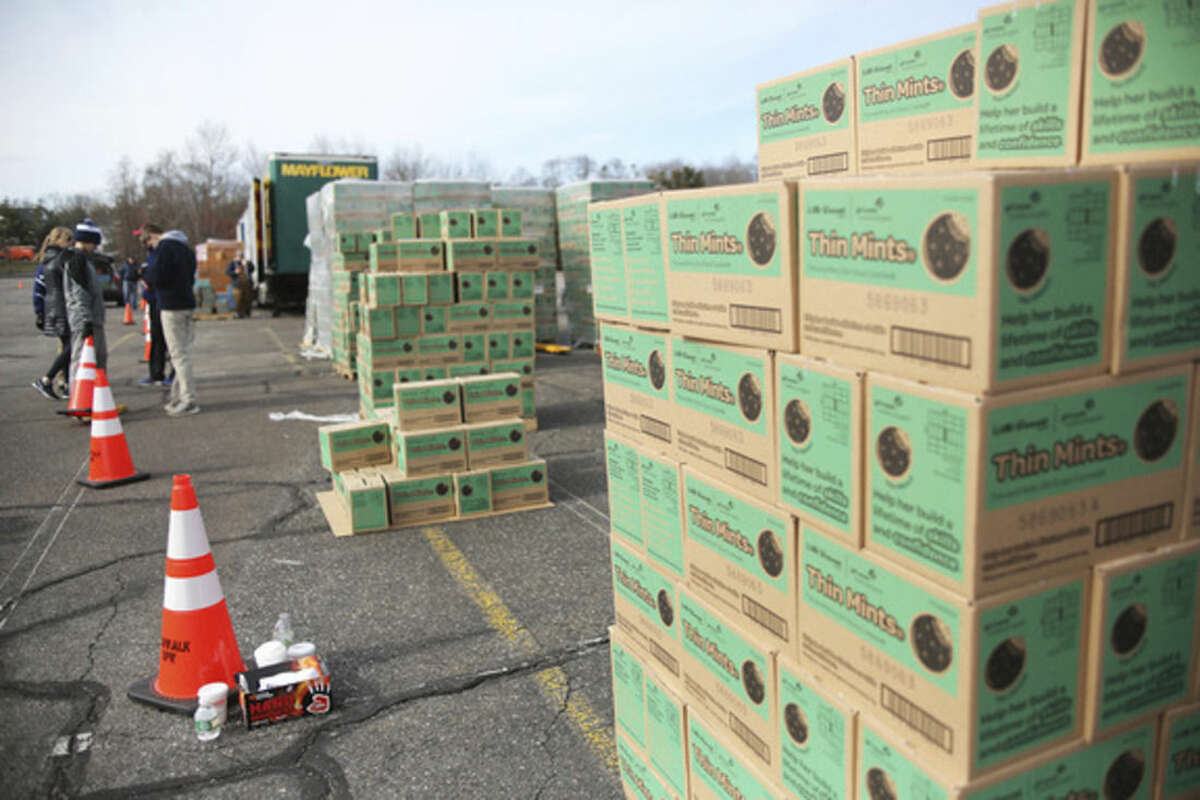Boxes of Thin Mints wait to be picked up during a state wide cookie drop hosted by Girls Scouts of America at Norden Park in Norwalk Saturday morning. Hour Photo / Danielle Calloway
