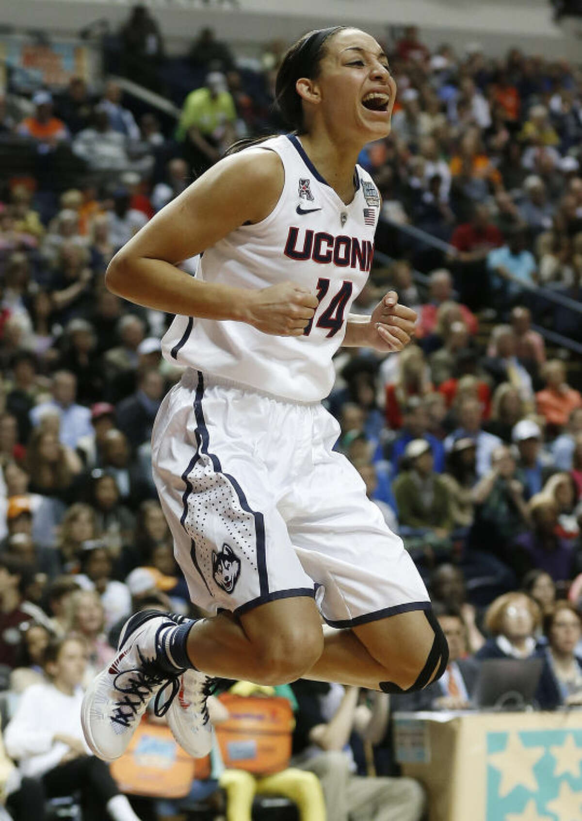 Connecticut guard Bria Hartley (14) celebrates her basket against Stanford during the second half of the semifinal game in the Final Four of the NCAA women's college basketball tournament, Sunday, April 6, 2014, in Nashville, Tenn. (AP Photo/John Bazemore)