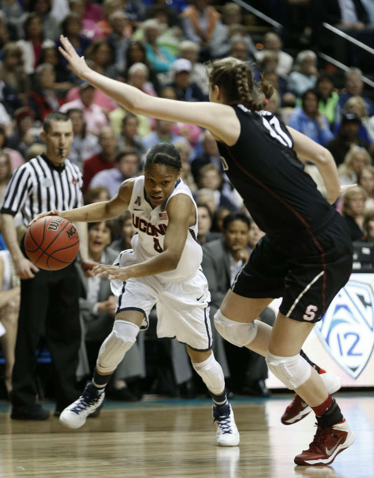 Connecticut guard Moriah Jefferson (4) moves by Stanford forward Bonnie Samuelson (41) during the first half of the semifinal game in the Final Four of the NCAA women's college basketball tournament, Sunday, April 6, 2014, in Nashville, Tenn. (AP Photo/Mark Humphrey)