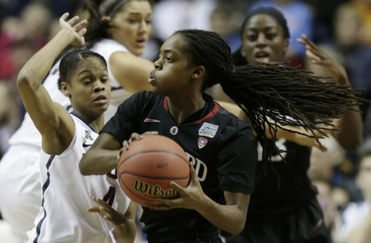 Connecticut guard Moriah Jefferson (4) defends Stanford guard Lili Thompson (1) during the first half of the semifinal game in the Final Four of the NCAA women's college basketball tournament, Sunday, April 6, 2014, in Nashville, Tenn. (AP Photo/Mark Humphrey)