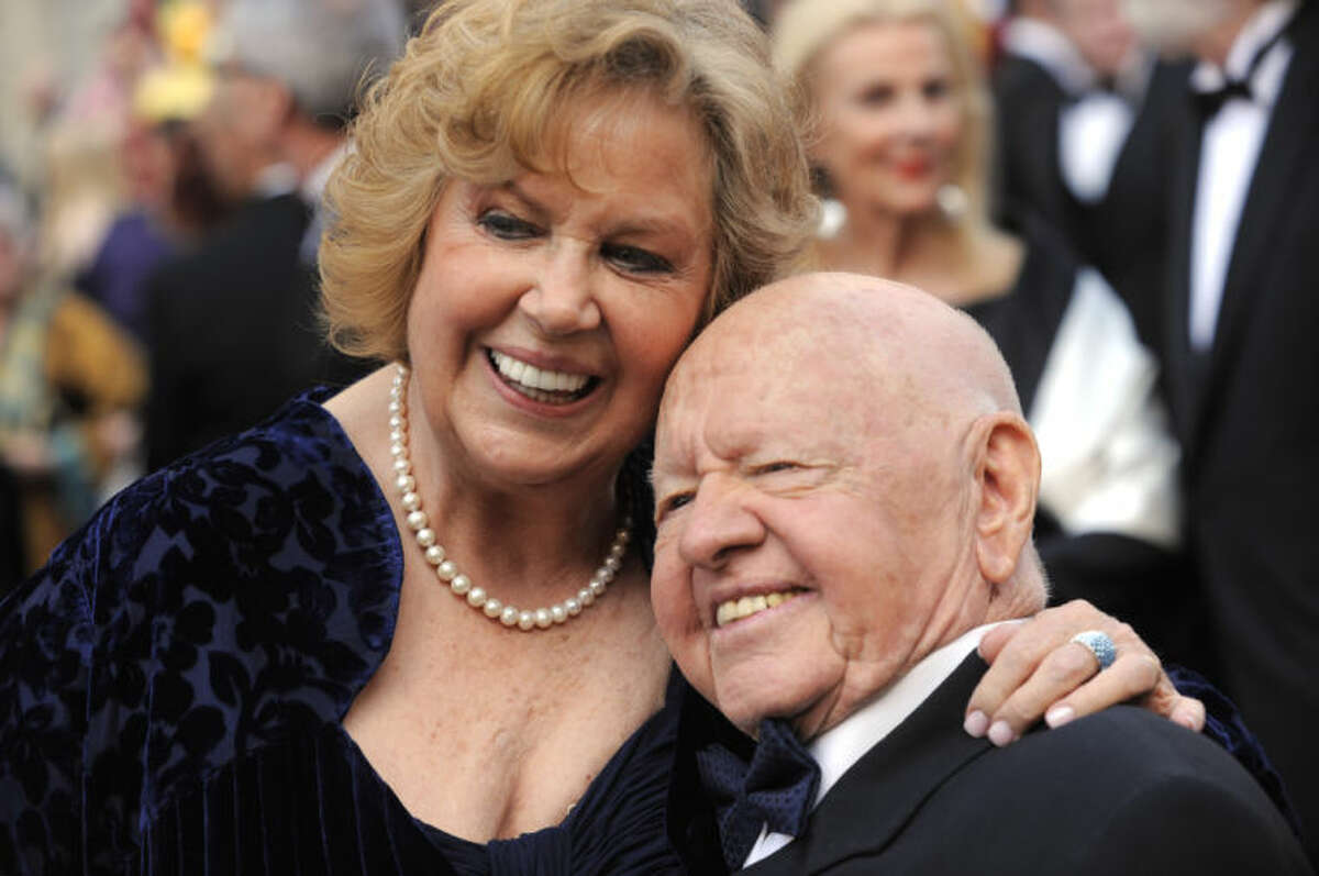 FILE - In this Sunday, March 7, 2010, file photo, Mickey Rooney, right, and Jane Rooney arrive during the 82nd Academy Awards, in the Hollywood section of Los Angeles. Rooney, a Hollywood legend whose career spanned more than 80 years, has died. He was 93. Los Angeles Police Commander Andrew Smith said that Rooney was with his family when he died Sunday, April 6, 2014, at his North Hollywood home. (AP Photo/Chris Pizzello, File)