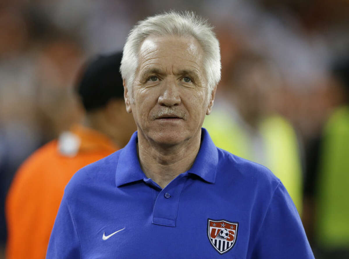 In this Sept. 3, 2013, photo, U.S. women's national soccer team coach Tom Sermanni waits for an international friendly against Mexico in Washington. U.S. Soccer says Sermanni has been fired as coach. The Americans beat China 2-0 in an exhibition game Sunday, April 6, 2014, in Commerce City, Colo. Hours later, the U.S. soccer announced the move in a news release. (AP Photo/Alex Brandon)