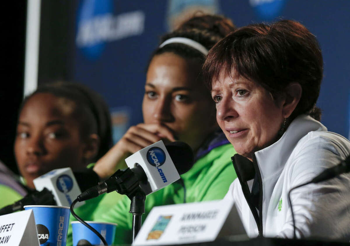Notre Dame head coach Muffet McGraw, right, answers questions during a news conference at the NCAA women's Final Four college basketball tournament Monday, April 7, 2014, in Nashville, Tenn. Notre Dame is scheduled to face Connecticut in the championship game Tuesday. (AP Photo/John Bazemore)