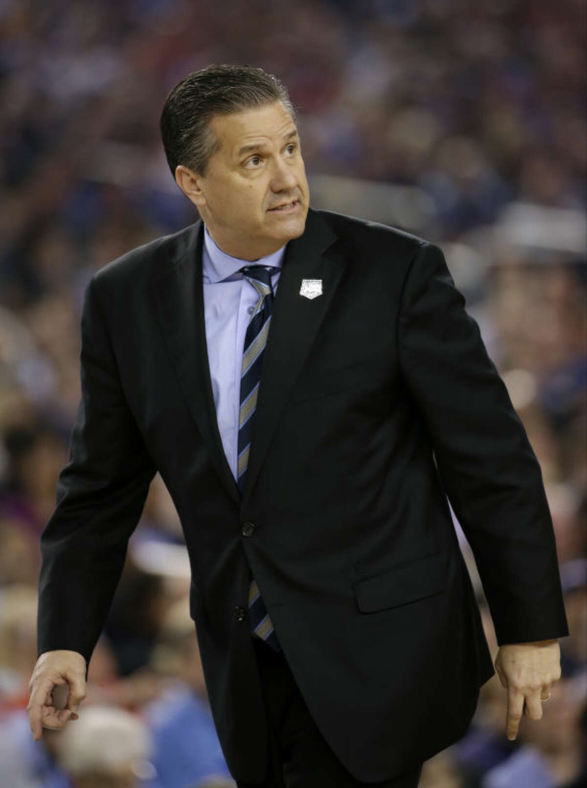 Kentucky head coach John Calipari looks on during the first half of the NCAA Final Four tournament college basketball championship game against Connecticut Monday, April 7, 2014, in Arlington, Texas. (AP Photo/David J. Phillip)
