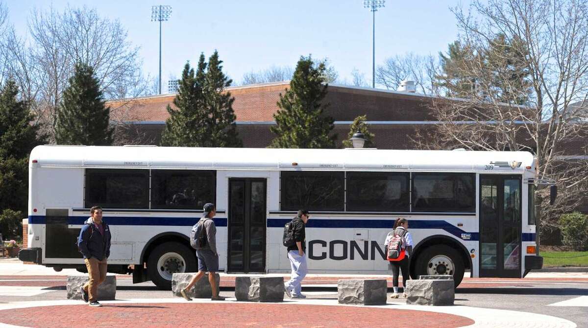 A campus bus picks up students in front of the University of Connecticut student union on Thursday, April 14, 2016, in Storrs, Conn.