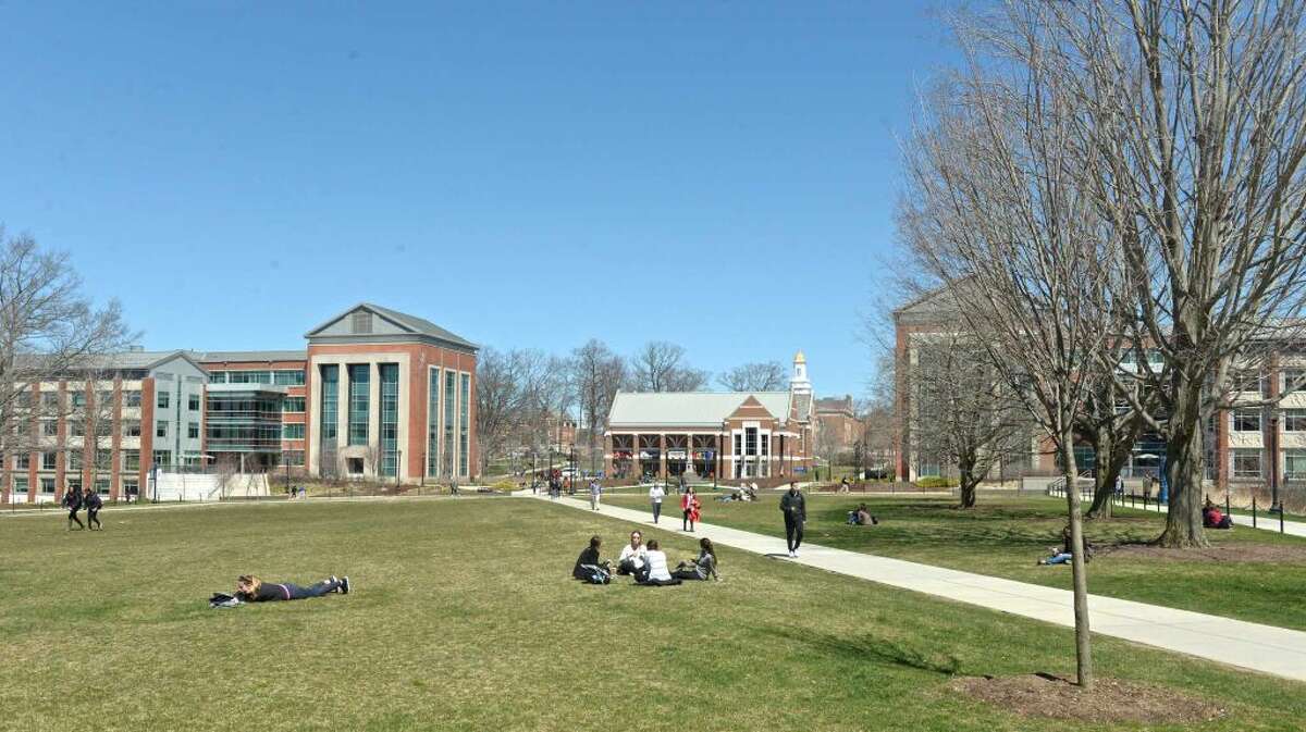 Students take advantage of the warm weather on the Student Union Mall of the University of Connecticut campus, on Thursday, April 14, 2016, in Storrs, Conn.