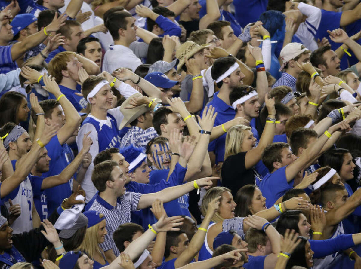 Kentucky fans cheer during the first half of the NCAA Final Four tournament college basketball championship game against Connecticut Monday, April 7, 2014, in Arlington, Texas. (AP Photo/Tony Gutierrez)