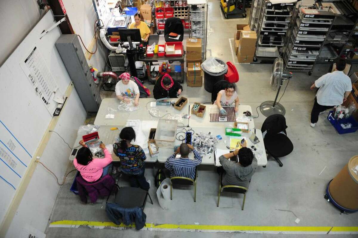 Factory work going on at Electri-Cable Assemblies in Shelton, Conn., on Thursday Apr. 14, 2016. An extra federal unemployment tax, which was imposed on businesses after the Great Recession in 2009, will be coming to an end soon.