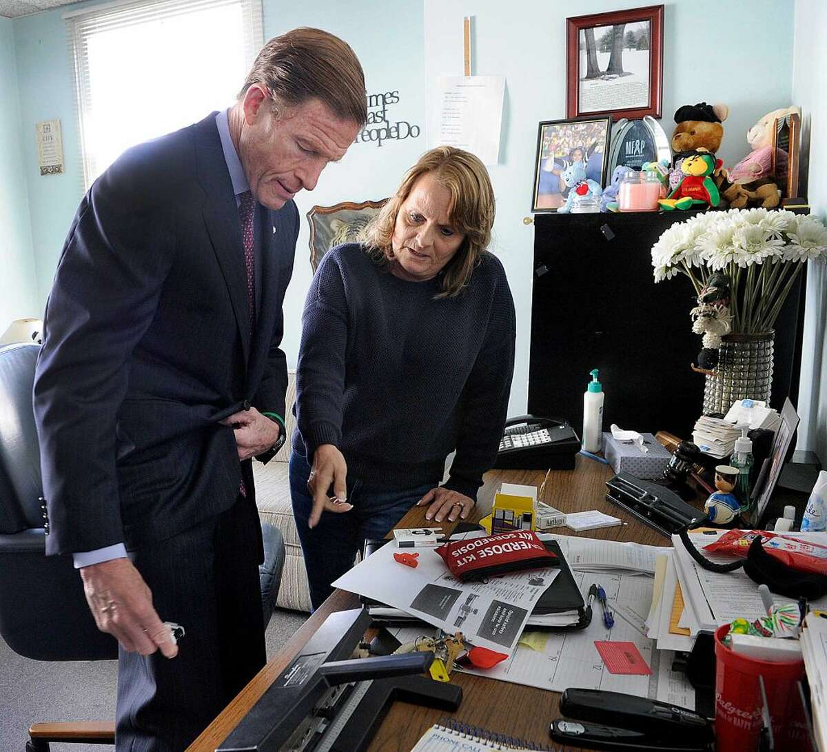 Joanne Montgomery, director of behavior health services at the AIDS Project Greater Danbury, explained the use of a Nalaxone Narcan auto injector to U.S. Sen. Richard Blumenthal during a visit to the AIDS Project in Danbury last month.