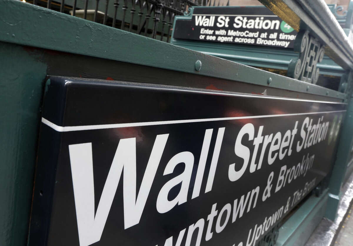 FILE - This Oct. 2, 2014 file photo shows the Wall Street subway stop on Broadway, in New York's Financial District. Asian stocks markets sagged Tuesday, June 16, 2015, as global jitters mounted over whether Greece and its creditors can reach a bailout agreement. (AP Photo/Richard Drew)