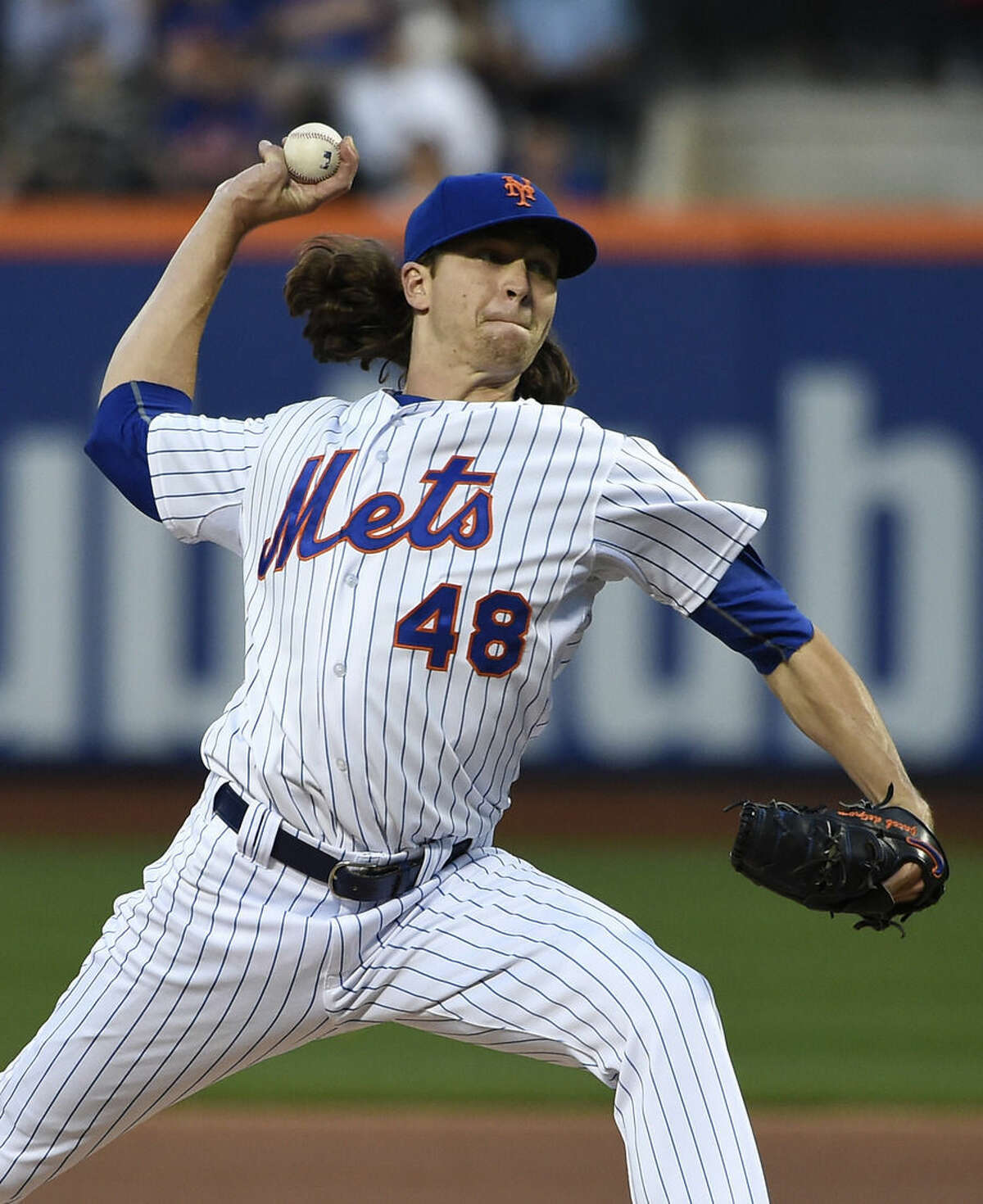 New York Mets starter Jacob deGrom (48) pitches in the first inning of a baseball game against the Miami Marlins at Citi Field on Saturday, April 18, 2015, in New York. (AP Photo/Kathy Kmonicek)