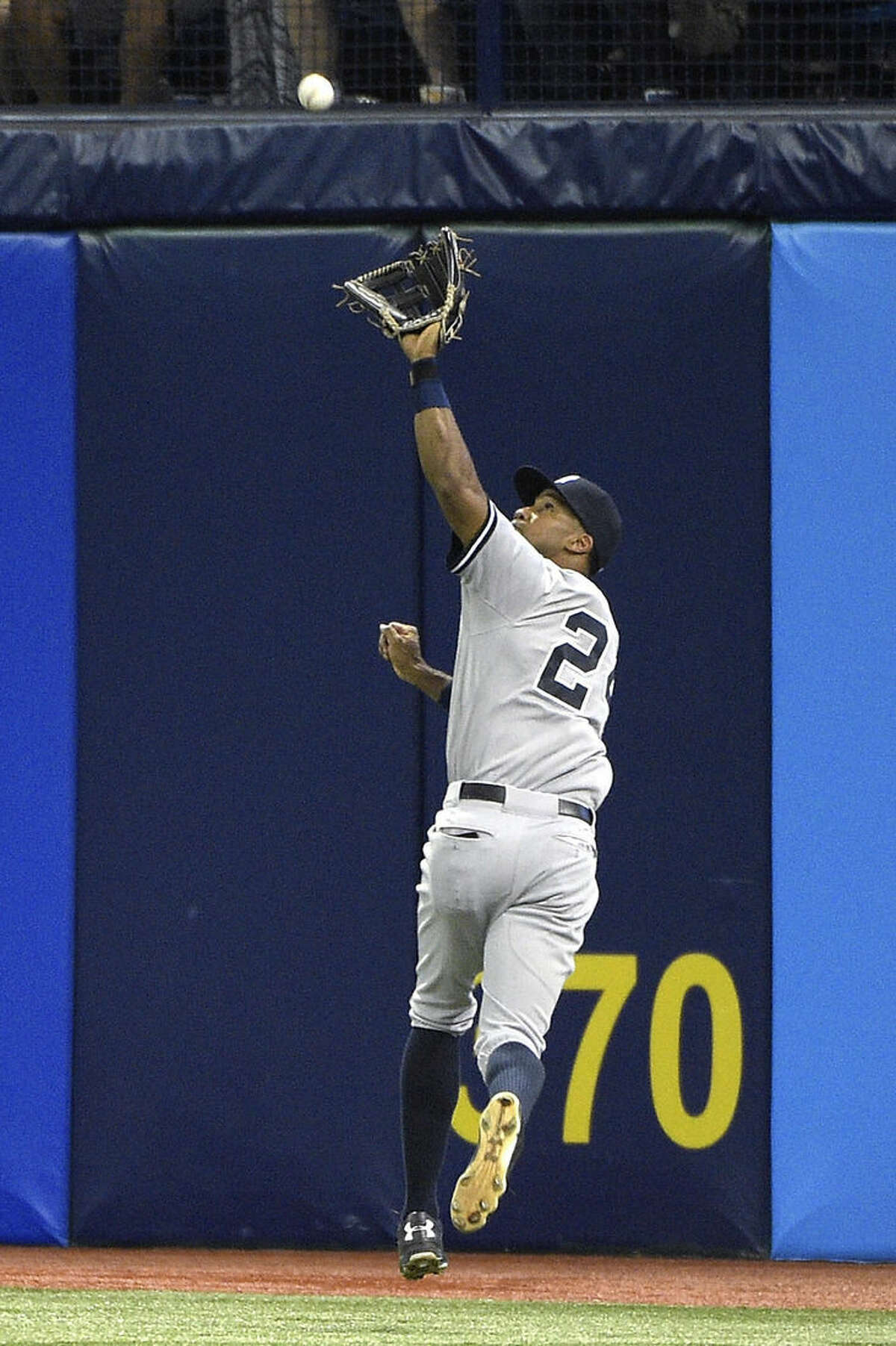 New York Yankees right fielder Chris Young catches a fly out from Tampa Bay Rays' Desmond Jennings at the warning track during the fifth inning of a baseball game in St. Petersburg, Fla., Saturday, April 18, 2015.(AP Photo/Phelan M. Ebenhack)