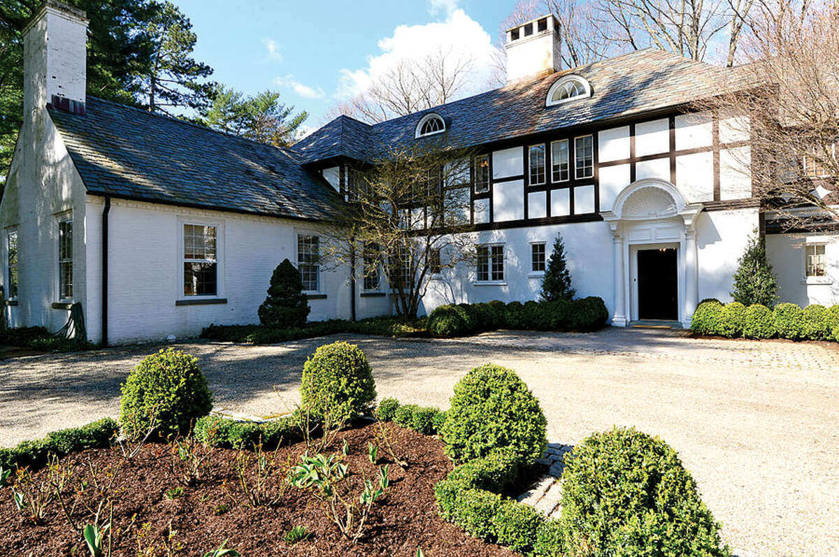 Hour photo / Erik Trautmann 1926 Tudor Manor House sited on a 128 acre Luxury Equestrian Estate for sale in Wilton. There is more than 10,000 square feet of living space that includes 11 bedrooms, 12 bathrooms, an eight car garage, inground pool, staff quarters on main and upper level, elevator, Two lakes, ponds, stocked trout streams, waterfalls and five miles of scenic horse trails.
