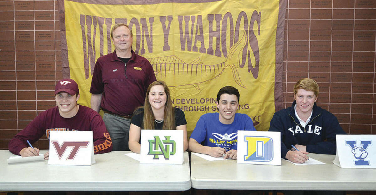 Next-level performers Wilton Y Wahoos' head coach Randy Erlenbach stands behind his swimming signees from the left, Stamford's Oscar Ike who is going to Virginia Tech, Wilton's Syndi Robinson, who if going to the University of Notre Dame, Norwalk's Dillon DiGugliemo who is going to the University of Deleware and Weston's Edward Stolarski is going to Yale University. To read a complete story on all four swimmers, visit us online at www.wiltonvillager.com. Hour photo/Alex von Kleydorff