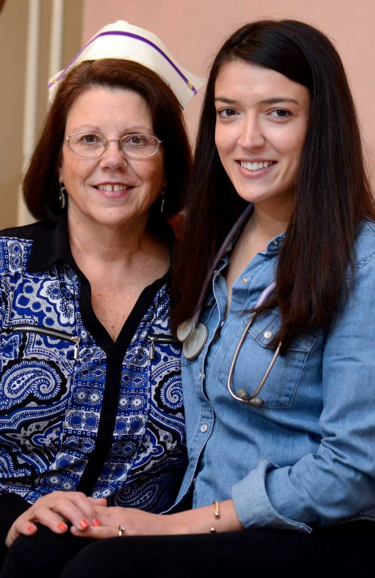 Lorraine Olson and her daughter Kelly, 26, are photographed on April 26, 2016 at their North Stamford home. Ms. Olson will fulfill her girlhood dream of becoming a nurse, like her mother, when she graduates from University of Bridgeport nursing school on Monday.
