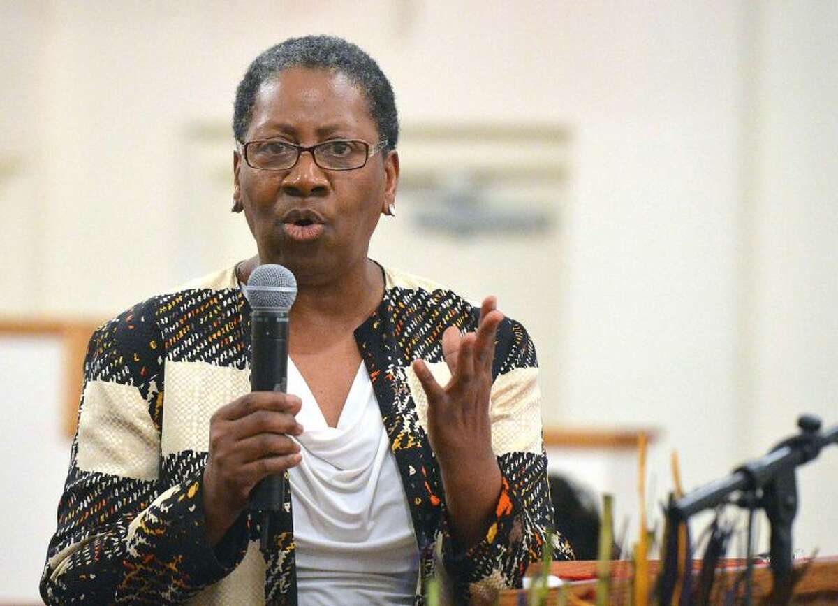Hour Photo/Alex von Kleydorff . Min. Mary L. Williams with the Faith Tabernacle MBC in Stamford preaches during Friendship Baptist Church of Stamford i'Seven Women at The Cross' on Wednesday night