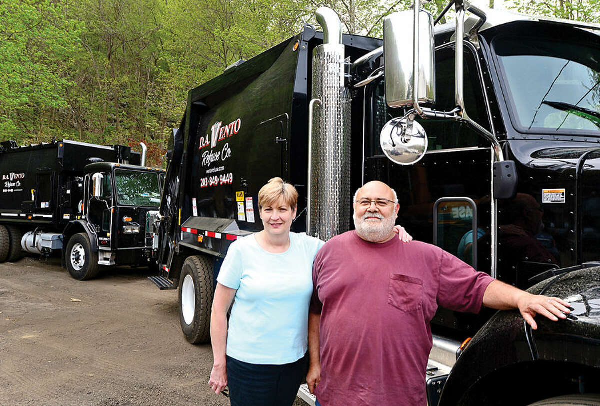 Darlene and Domincik Vento, with one of their new, re-purposed multi-stream recycling trucks.