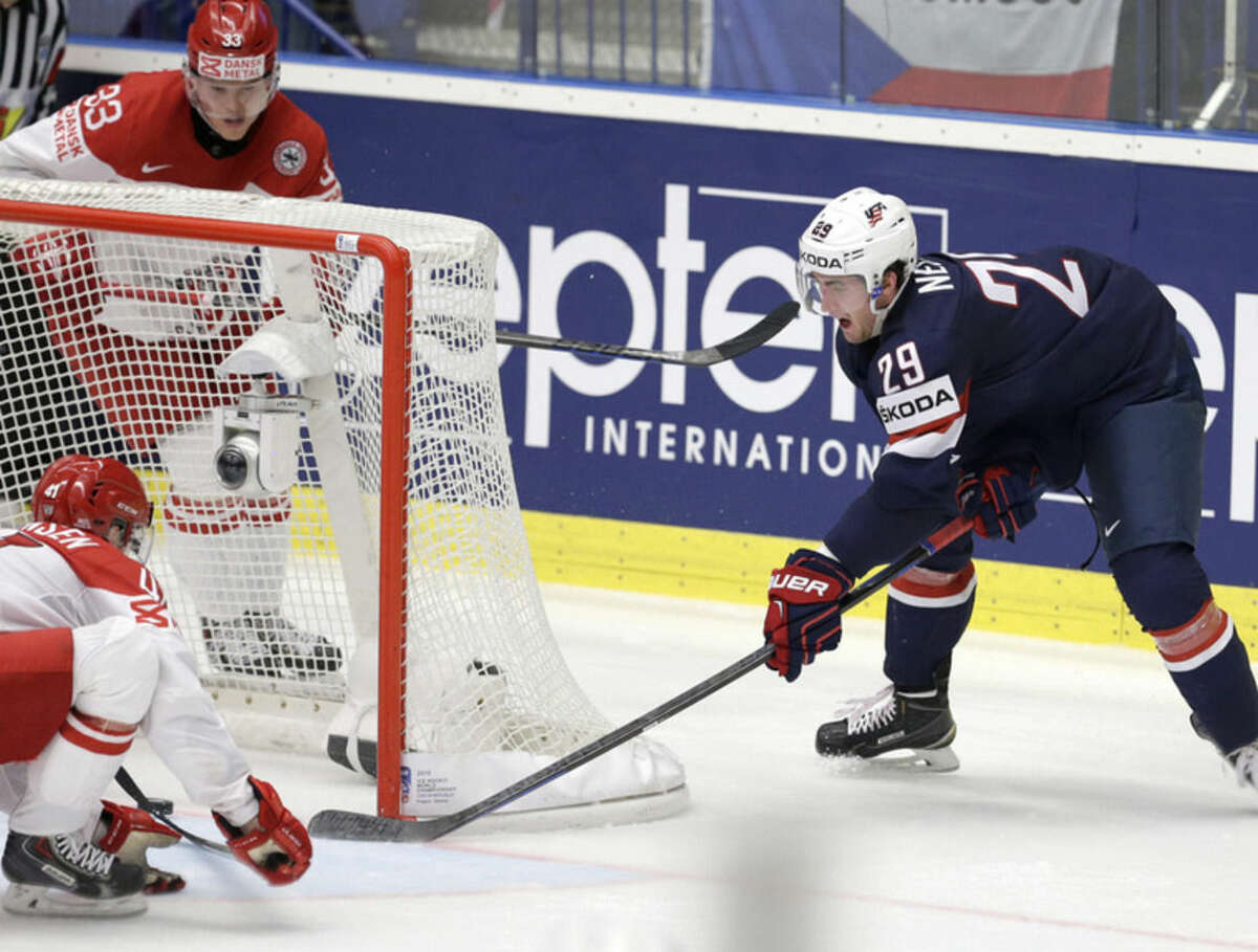 Brock Nelson of USA, right, scores the opening coal against Denmark during a Hockey World Championships Group B match in Ostrava, Czech Republic, Friday, May 8, 2015. (AP Photo/Sergei Grits)