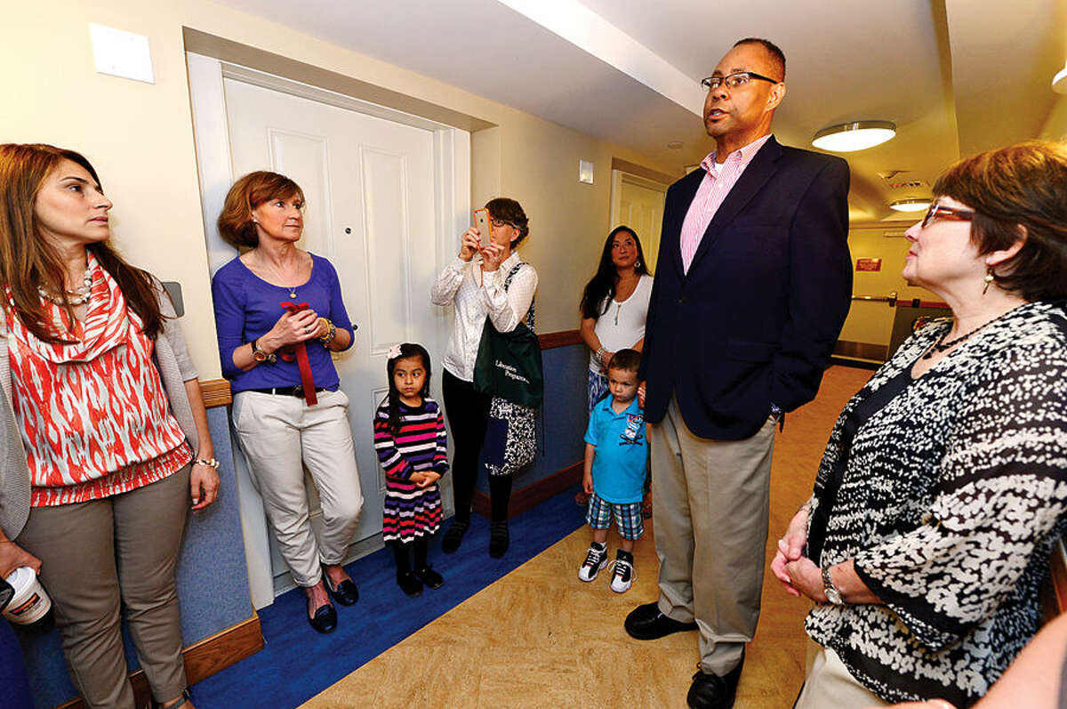 Hour photo / Erik Trautmann Liberation House president and CEO Alan Mathis makes his remarks during the unveiling of the new Bright Space playroom Saturday for the Families In Recovery Program that was donated by Bright Horizons.