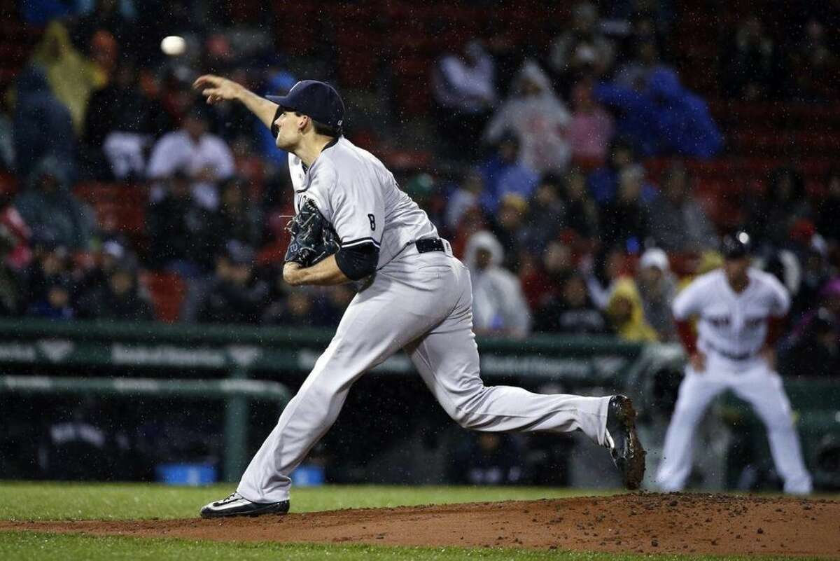 New York Yankees' Nathan Eovaldi pitches during the first inning of a baseball game against the Boston Red Sox in Boston, Sunday, May 1, 2016. (AP Photo/Michael Dwyer)
