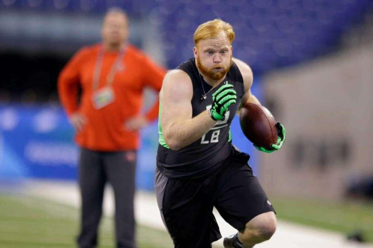 Temple linebacker Tyler Matakevich runs a drill at the NFL football scouting combine in Indianapolis, Sunday, Feb. 28, 2016. (AP Photo/Michael Conroy)