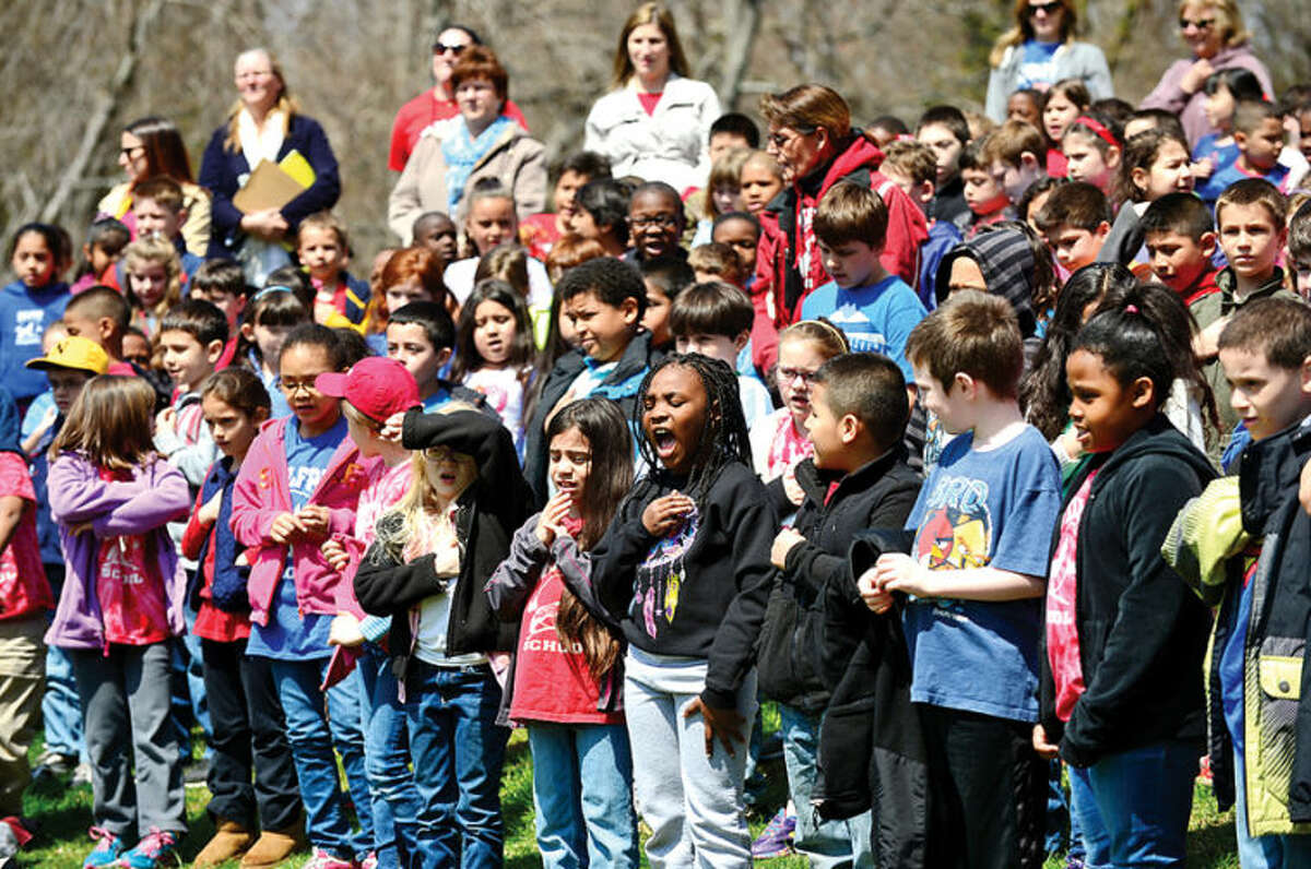 Hour photo / Erik Trautmann The student body says the Pledge of Allegiance as the Norwalk Tree Advisory Committee, the Norwalk Tree Alliance and the Norwalk Public Schools conduct an Arbor Day Celebration at Wolfpit Elementary School Friday. The program featured a proclamation from Mayor Harry Rilling, remarks by Schools Superintendent Dr. Manuel Rivera, poster contest prizes and the planting of a tree.