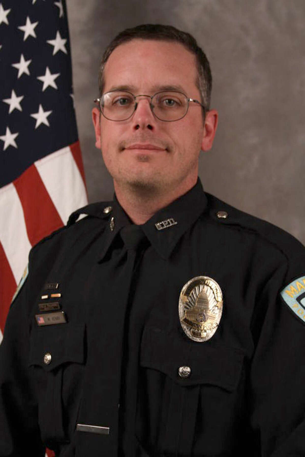 FILE - This undated file photo provided by the Madison, Wis., Police Department shows Officer Matt Kenny. Kenny fatally shot an unarmed 19-year-old man in Madison on March 6, 2015. A prosecutor is set to announce Tuesday, May 12, 2015, whether the white police officer will face charges for killing the young unarmed biracial man in Madison. (AP Photo/Madison Police Department)