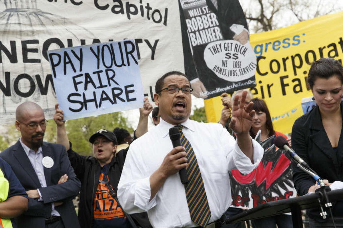 Rep. Keith Ellison, D-Minn. joins low-wage workers at a rally outside the Capitol in Washington, Monday, April 28, 2014, to urge Congress to raise the minimum wage as lawmakers return to Washington following a two week hiatus. Democrats been pushing to lift the minimum wage but even if any legislation is passed in the Senate, it is certain to be ignored in the Republican-controlled House. (AP Photo)