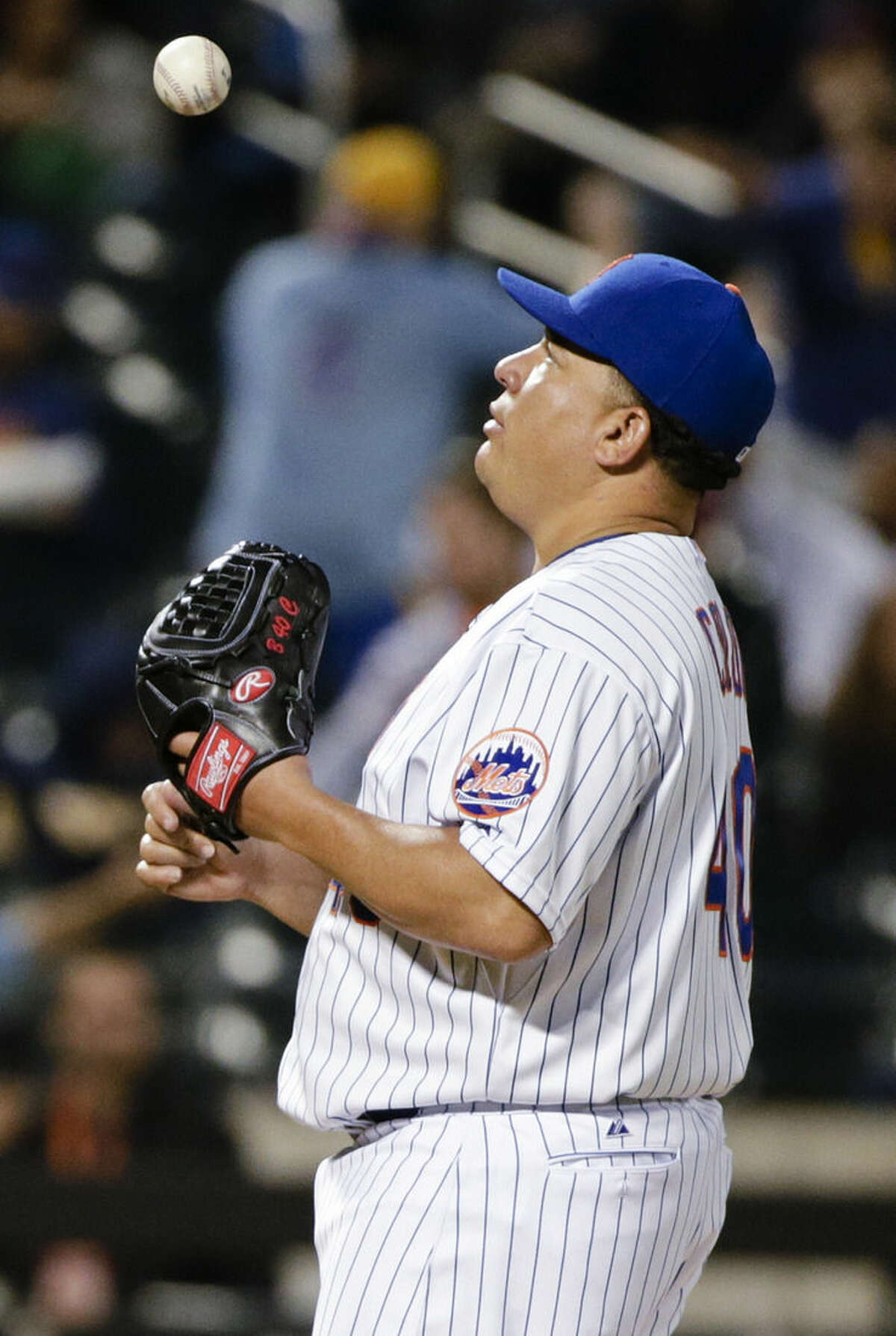 New York Mets starting pitcher Bartolo Colon tosses the ball to himself as Milwaukee Brewers' Gerardo Parra runs the bases after hitting a home run during the fifth inning of a baseball game Friday, May 15, 2015, in New York. (AP Photo/Frank Franklin II)