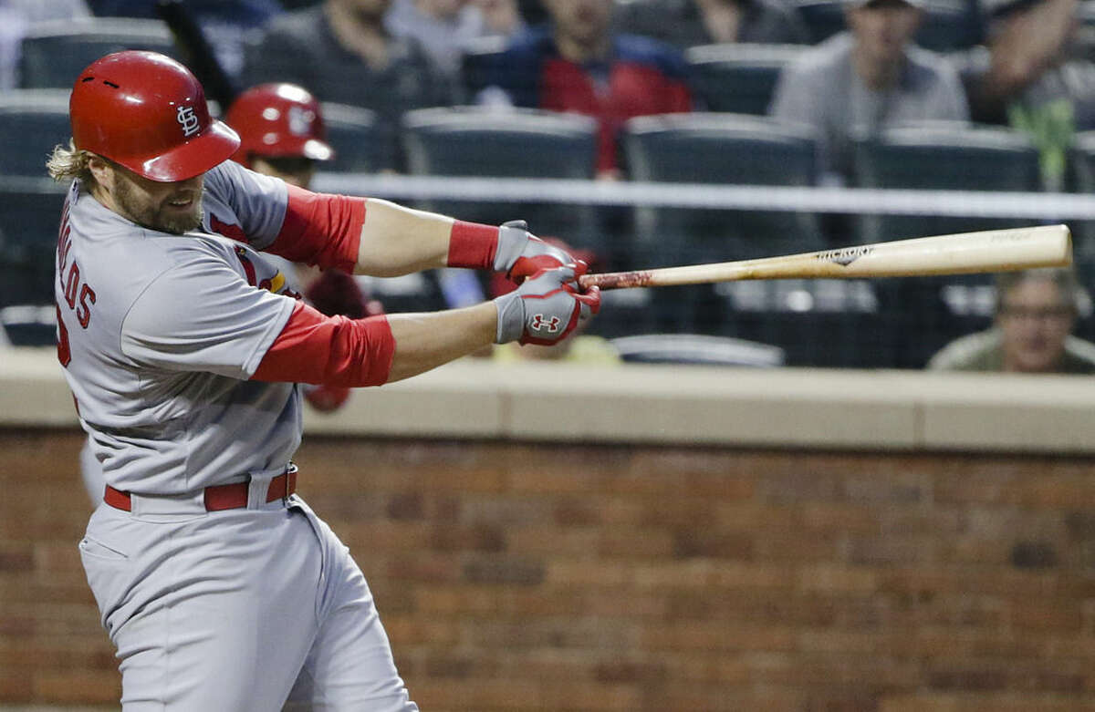 St. Louis Cardinals' Mark Reynolds follows through on a home run during the fourth inning of a baseball game against the New York Mets on Tuesday, May 19, 2015, in New York. (AP Photo/Frank Franklin II)