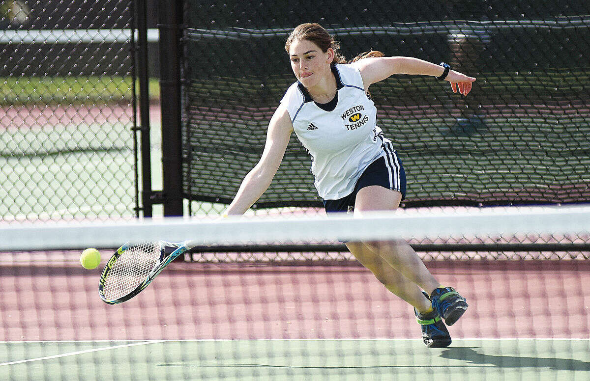 Weston's Andi Rosenblatt, playing in the No. 1 doubles match with Sarah Greisman, lunges for a shot during Wednesday's SWC championship match against Joel Barlow in Redding. (Hour photo/John Nash)