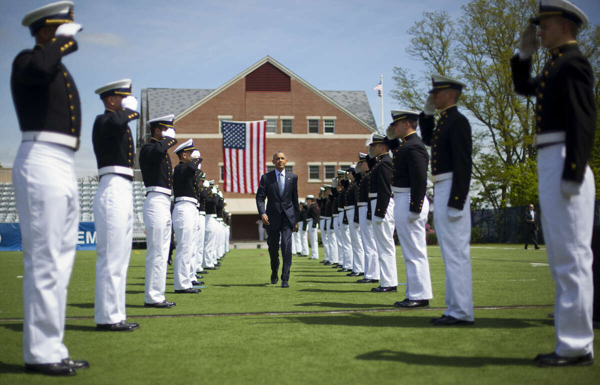 President Barack Obama walks in after being introduced at the U.S. Coast Guard Academy graduation in New London, Conn., Wednesday, May 20, 2015. (AP Photo/Pablo Martinez Monsivais)