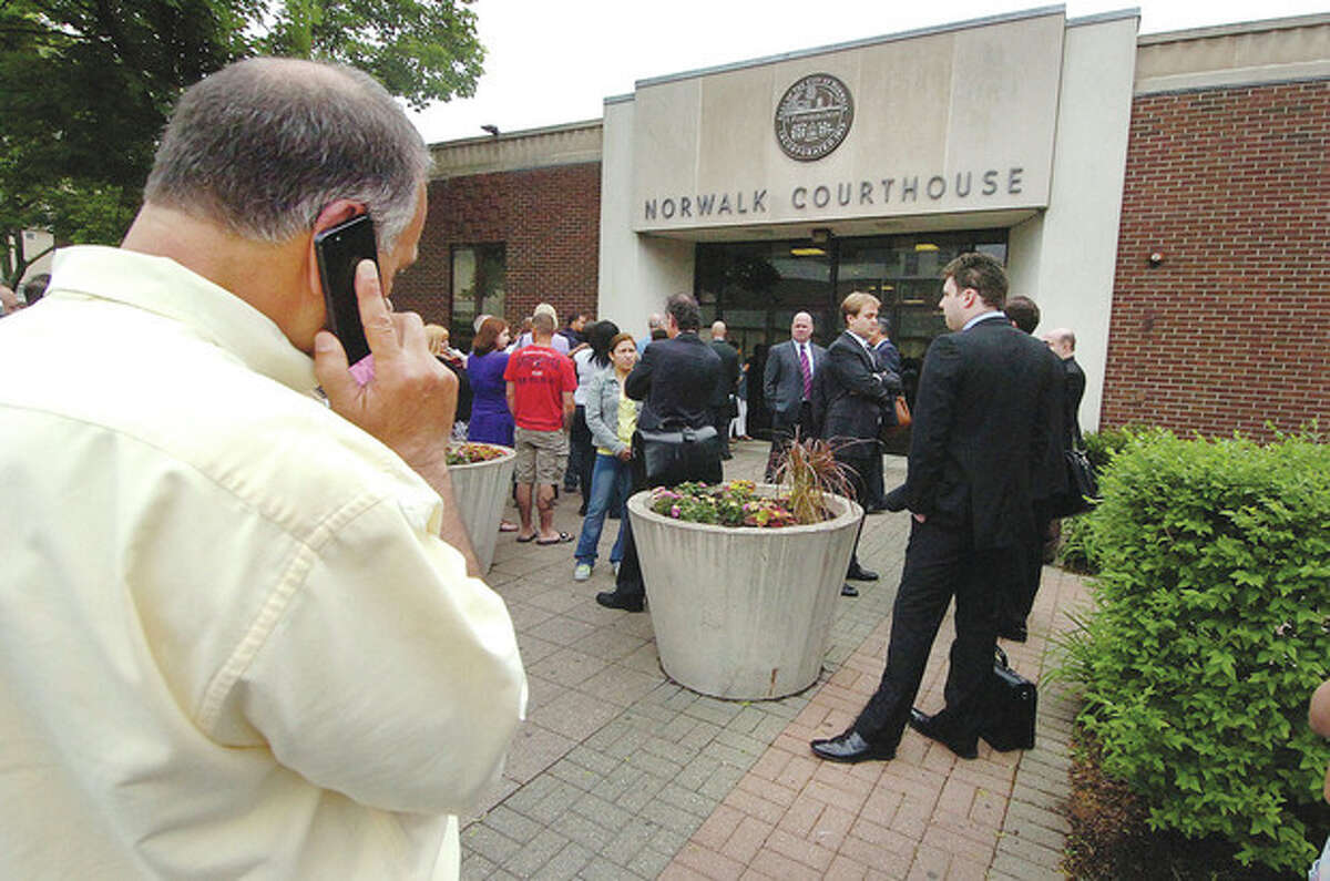 People wait outside the Norwalk Superior Court.