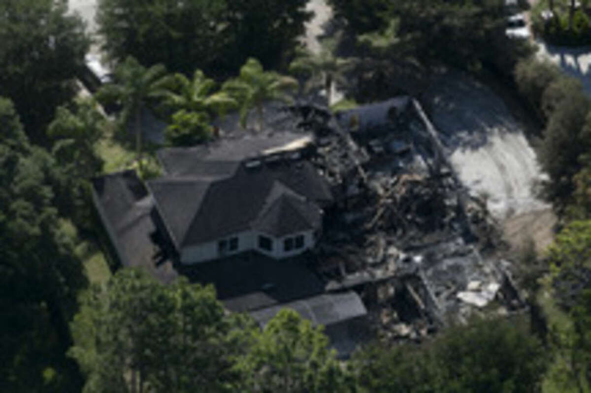 AP photo / The Tampa Bay Times, Eve Edelheit This aerial photo shows the burned out home on Thursday in Tampa, Fla. Authorities have said they think the fire at the five-bedroom home was intentionally set and that they found fireworks inside the home.