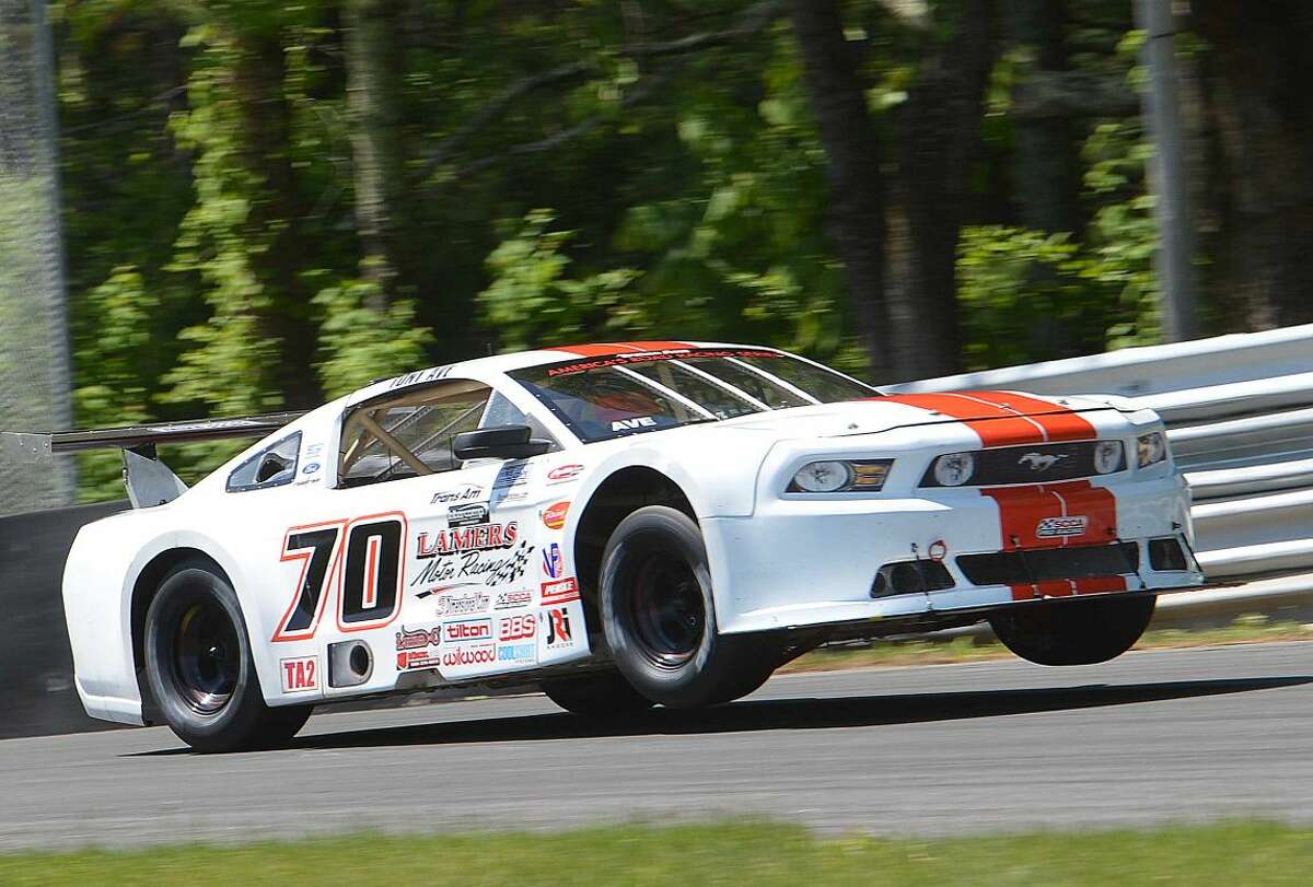 Hour Photo/Alex von Kleydorff Tony Ave gets some air off the Uphill on his way to a win in the The 3-Dimensional Services Muscle Car Challenge race, part of the Trans Am Series season opener at Lime Rock Park this weekend