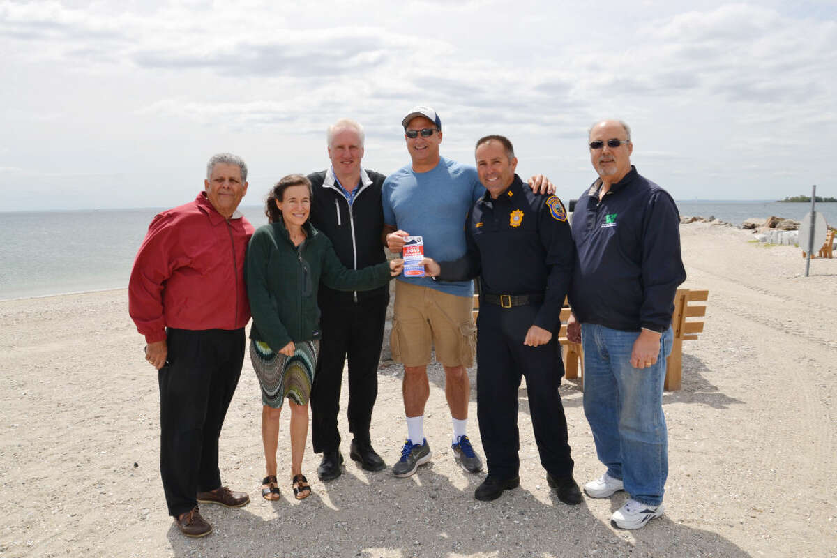 Contributed image The first ticket to PAL event sponsor, Melissa and Doug Bernstein, is presented at Compo Beach.