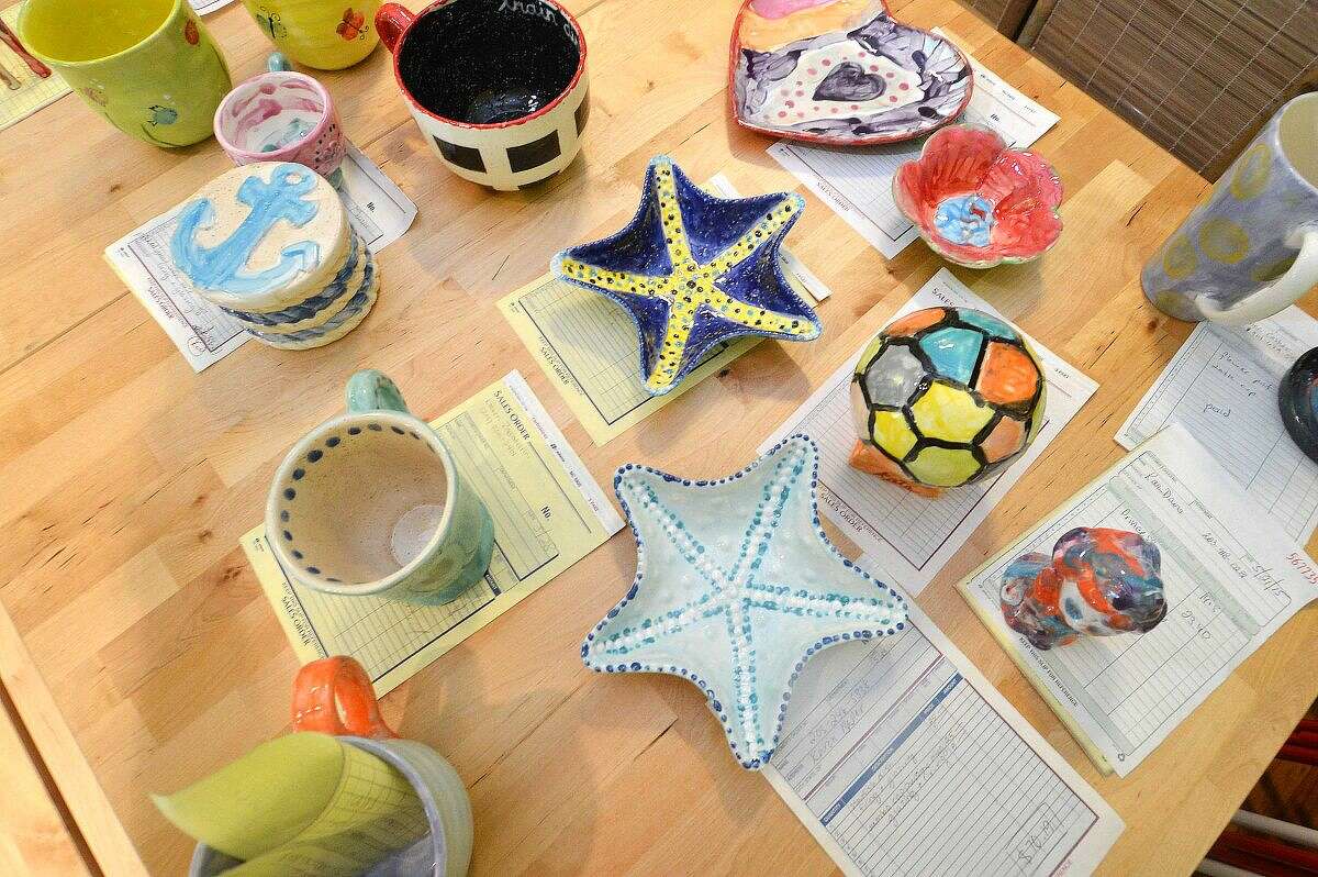 Customers' finished pottery is ready at Happy Hands Art & Pottery in Wilton.