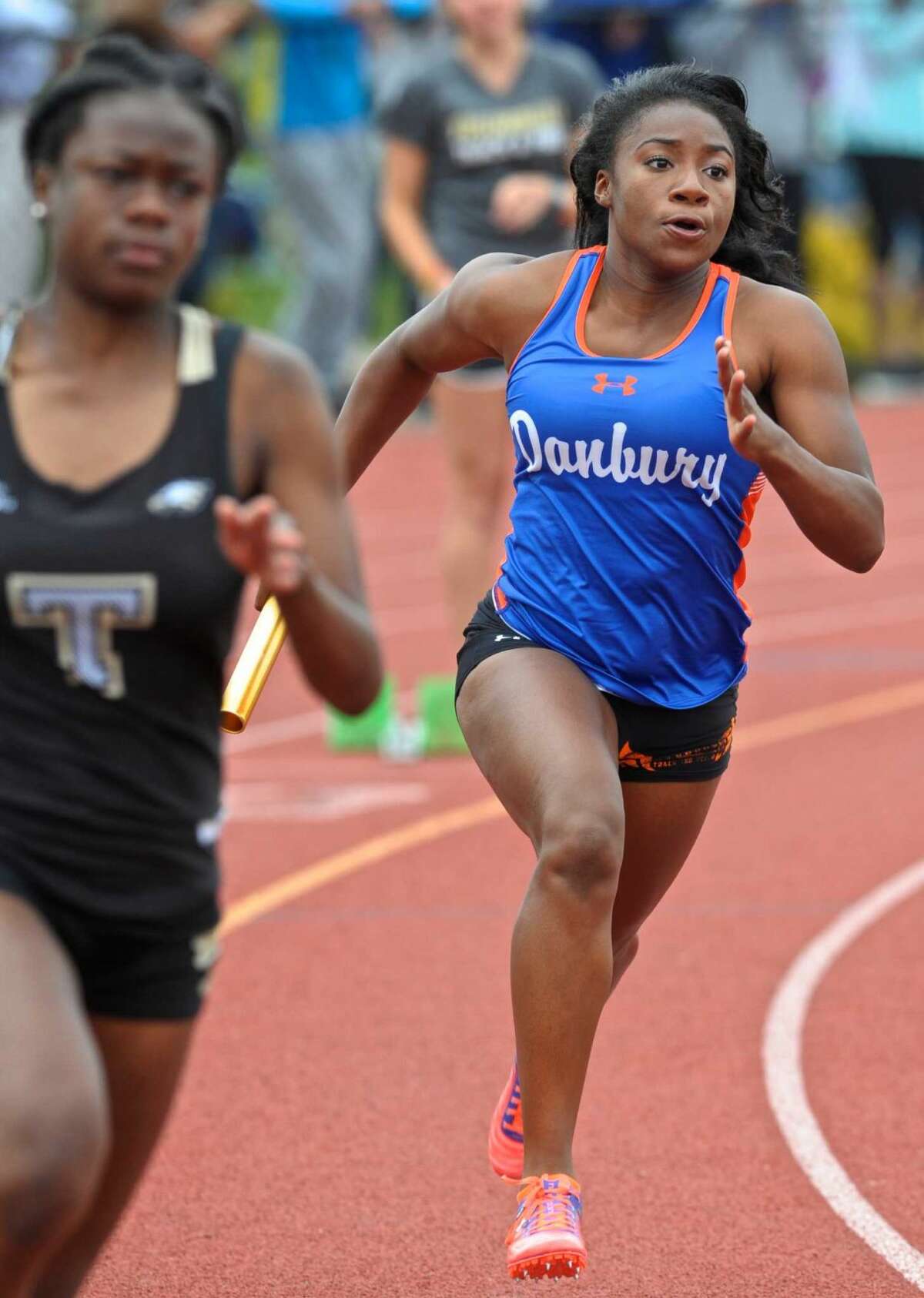 Saintphanie Porcenat runs the first leg of the girls 4x100 meter relay for Danbury during the FCIAC girls track championships, held at Bethel High School, Saturday, May 21, 2016, in Bethel, Conn.